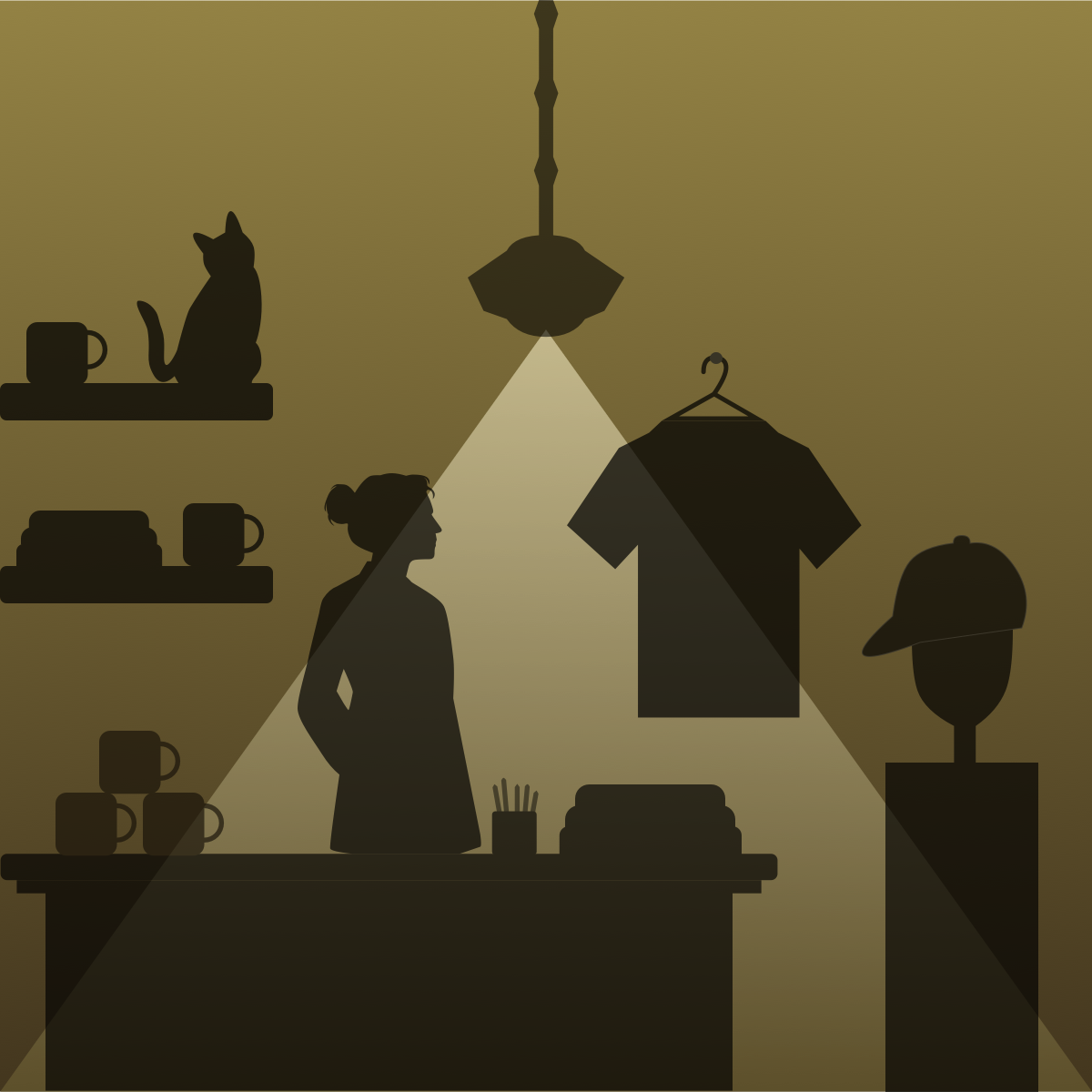Gift shop interior with a hanging shirt, caps, mugs and a cat on the shelf, lit by a pendant lamp